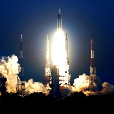 Rocket launching in dark blue background