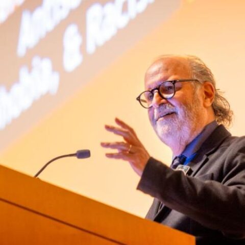 Man speaking at a podium