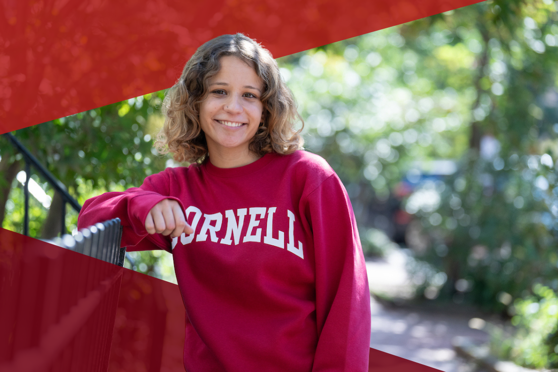 Student in DC wearing red Cornell sweatshirt
