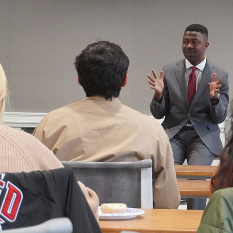 Speaker presenting in front of class