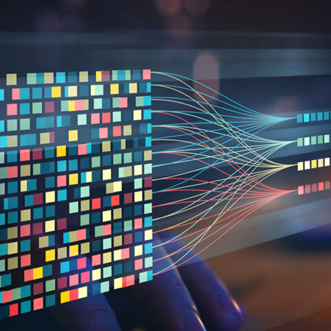 Blue, yellow, and red dots showing data visualization over computer screen