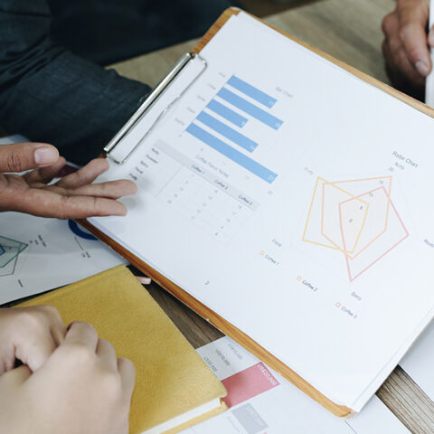 People working on a project looking at data reports