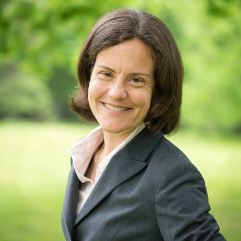 Alexandra Dufresne outside with green background