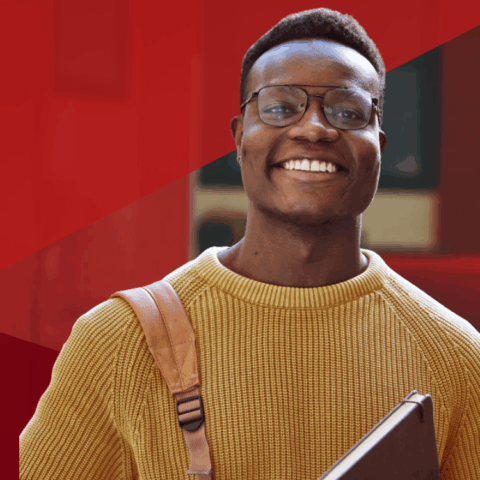 ESPP student wearing yellow sweater smiling at camera with red triangle overlays