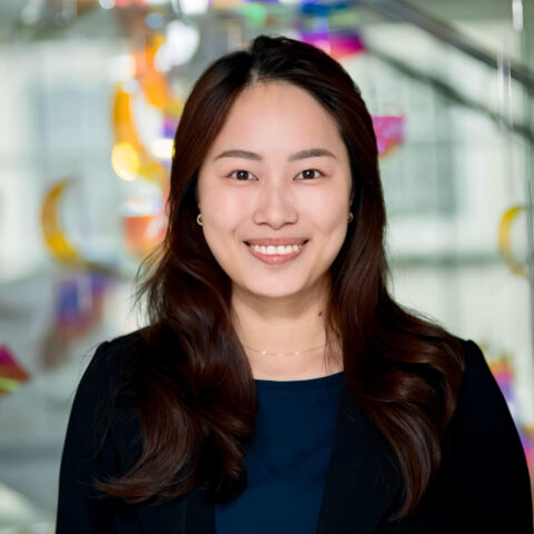 Woman smiling at camera wearing a black blazer