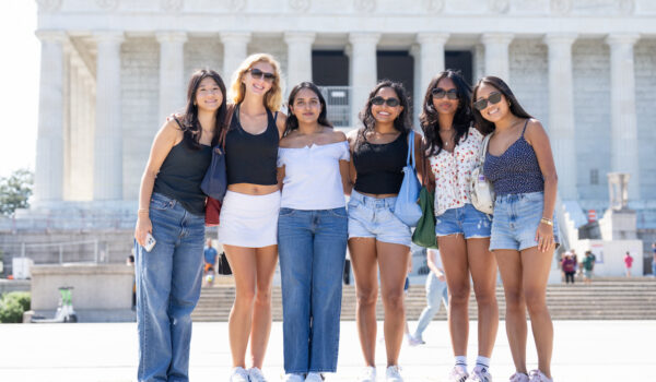 Group of six students in front of the National Mall in Washington D.C.