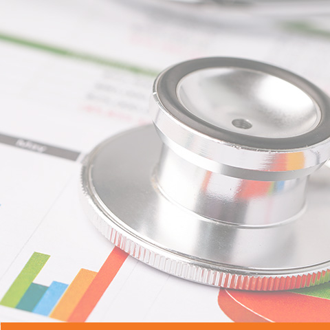 Stethoscope on charts and graphs