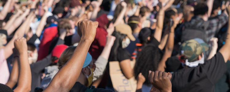 Group of protestors with fists in the air