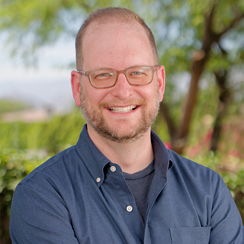 Peter Rich in front of environmental background