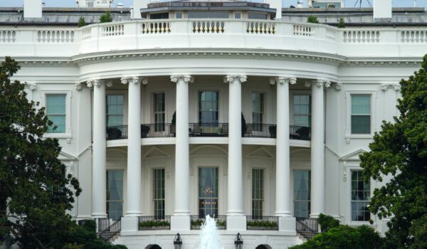 White House with blue sky behind it