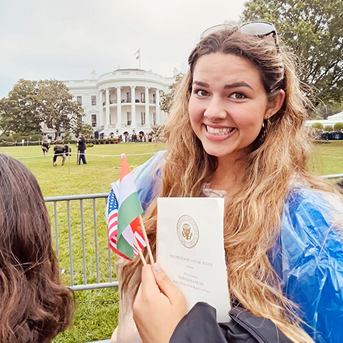Student standing in front of the White House
