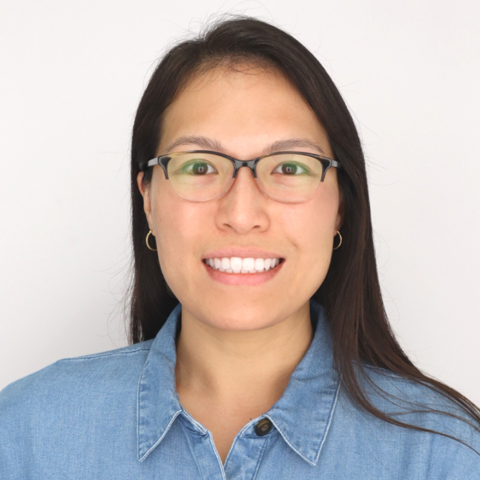 Sherry Wang in front of a white backdrop