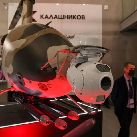 person with mask walking by new drone design
