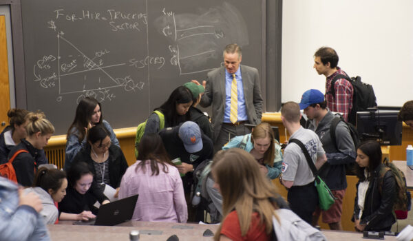 Rick Geddes talking with students in a classroom