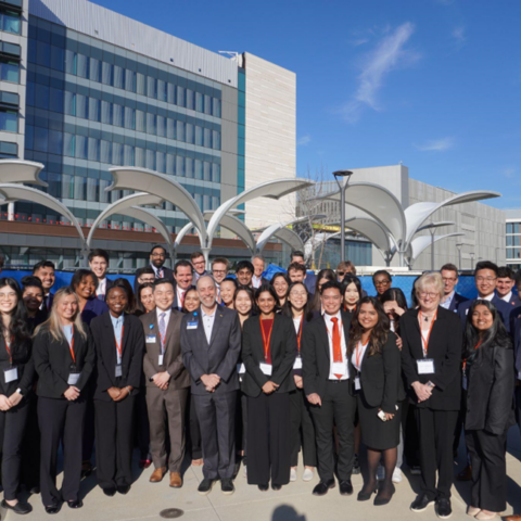 Health Student Association students and case competition judge group photo at the new UCI Health Chao Family Comprehensive Cancer Center.