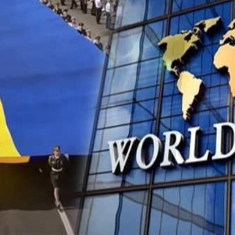 world bank building with people holding flag behind it